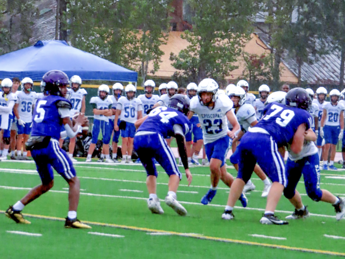 Freshman quarterback Jordan Young scans for a wide receiver to make a play Thursday, Sept. 5, 2024, during the third quarter in their game against Episcopal High School. Playing through rain, the Falcons’ game ended in a 14-6 loss in the final minutes of the fourth quarter of their second-ever game. Young states the loss “hurt, but now the team [and him] have to buckle down at practice so [they] can get the results [they] want in game.”